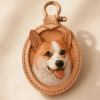 Custom pet portrait leather charm with a handmade dog portrait, natural leather frame, and gold hardware on a warm neutral background