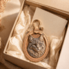 Custom cat portrait leather charm presented in a premium gift box with tissue paper, handmade natural leather frame, and gold hardware