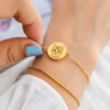 Gold-tone custom pet portrait bracelet with round charm made from a pet photo