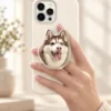 Custom pet photo phone grip featuring one personalized pet portrait on a phone.