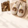 Pet photo transformed into a personalized pair of custom house slippers.